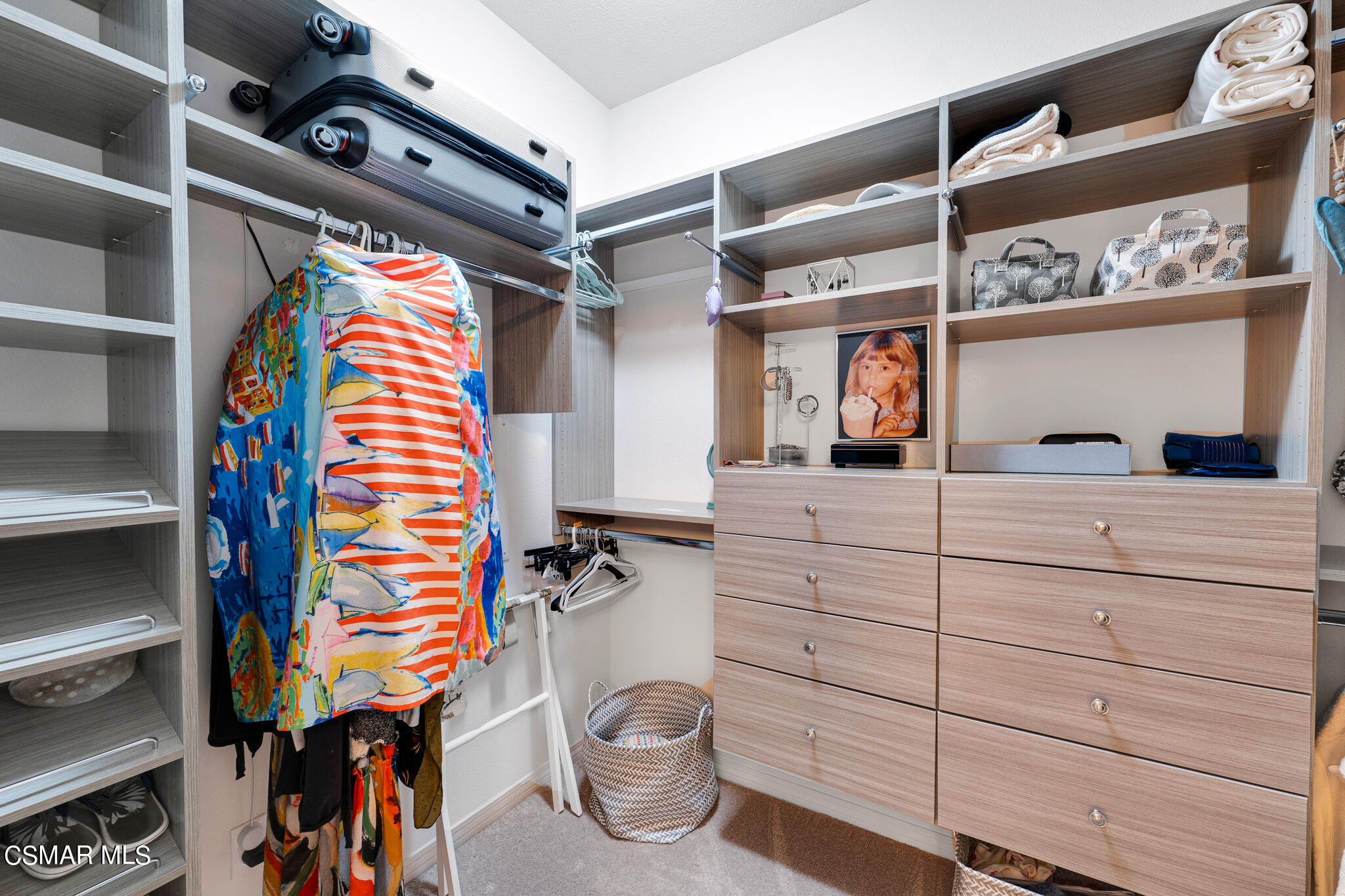 1233 Bayside Circle Oxnard, CA 93035 - Photo 24 of 37 a view of walk in closet with clothes and shoes