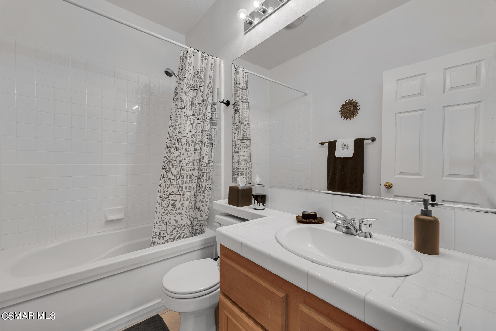 1233 Bayside Circle Oxnard, CA 93035 - Photo 28 of 37 a bathroom with a sink a toilet and a large mirror