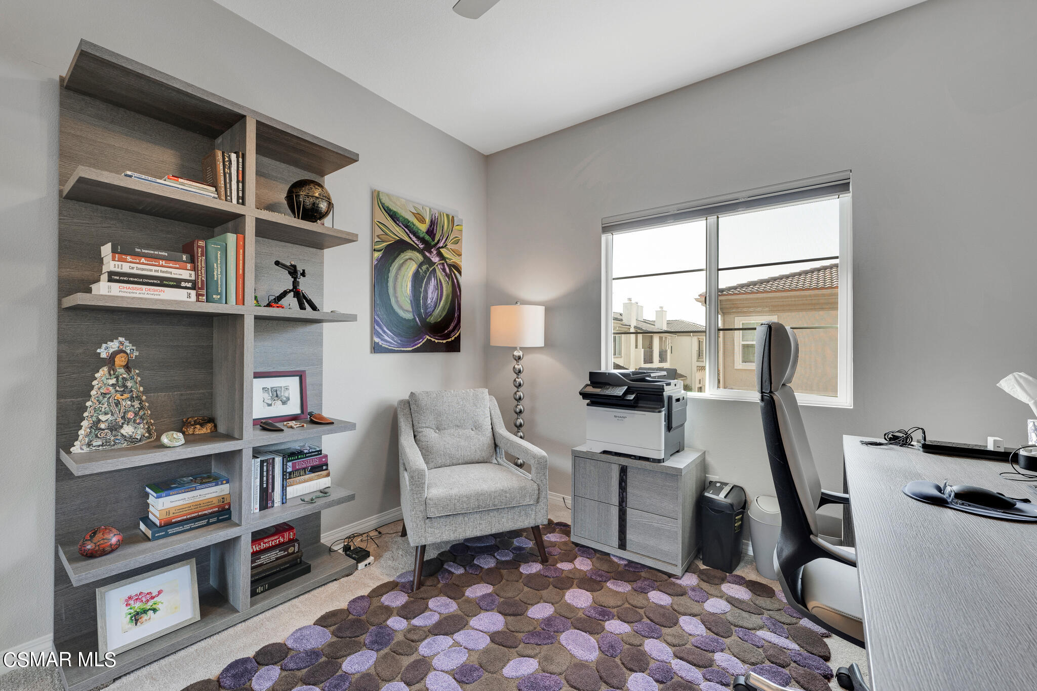 1233 Bayside Circle Oxnard, CA 93035 - Photo 29 of 37 a living room with furniture a rug and a painting on the wall