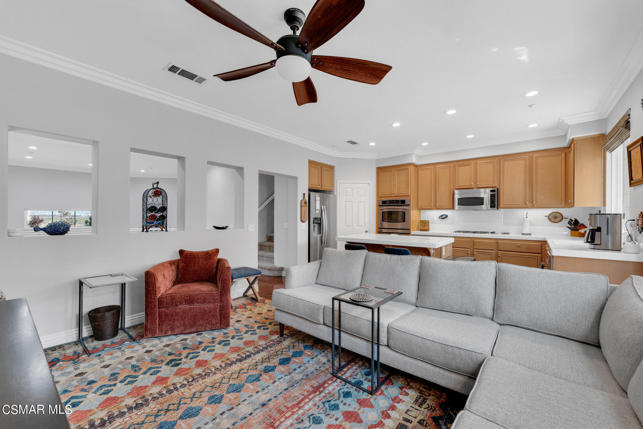 1233 Bayside Circle Oxnard, CA 93035 - Photo 3 of 37 a view of living room kitchen with furniture and flat screen tv