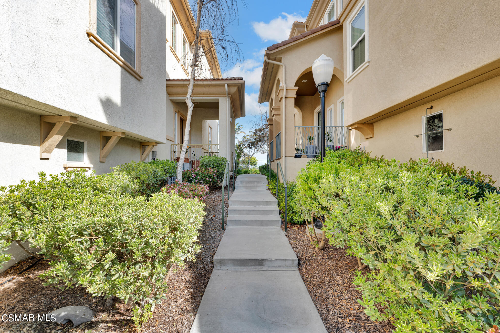 1233 Bayside Circle Oxnard, CA 93035 - Photo 34 of 37 a view of a pathway with house on both side