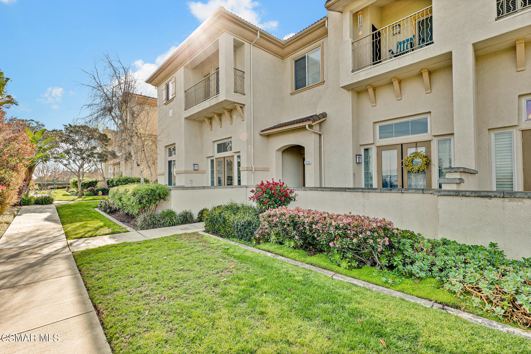 1233 Bayside Circle Oxnard, CA 93035 - Photo 35 of 37 a front view of a house with a garden