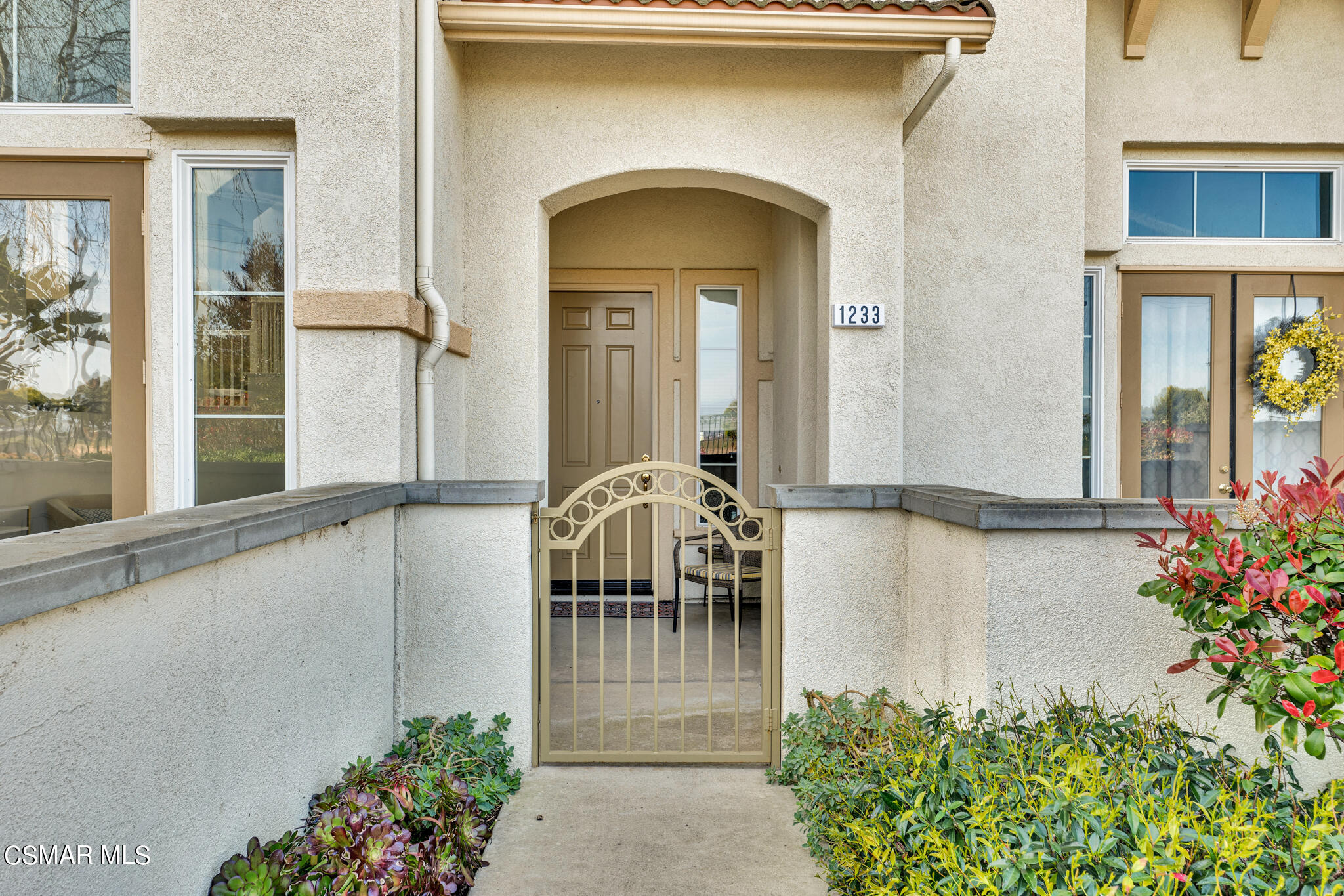 1233 Bayside Circle Oxnard, CA 93035 - Photo 5 of 37 a front view of a house with outdoor seating