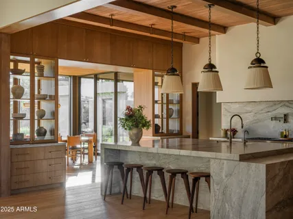 a bedroom with a bed and a table