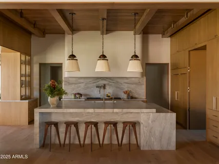 a view of walk in closet and empty room