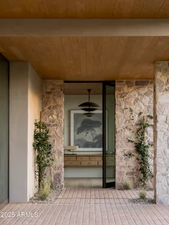 a view of a hallway with wooden floor and a fireplace