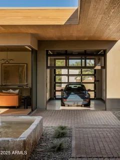 a kitchen with stainless steel appliances granite countertop a sink and wooden cabinets
