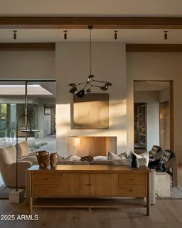 a kitchen with a sink a stove and two chairs