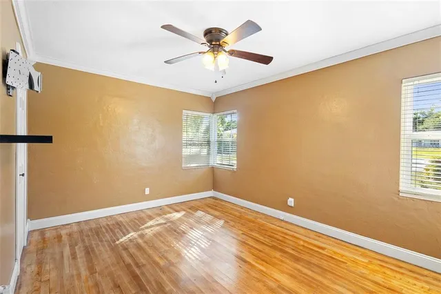 a view of room with window and ceiling fan