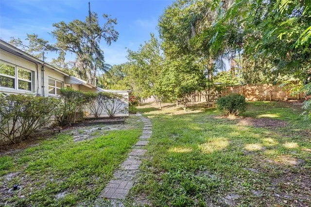 a backyard of a house with lots of green space