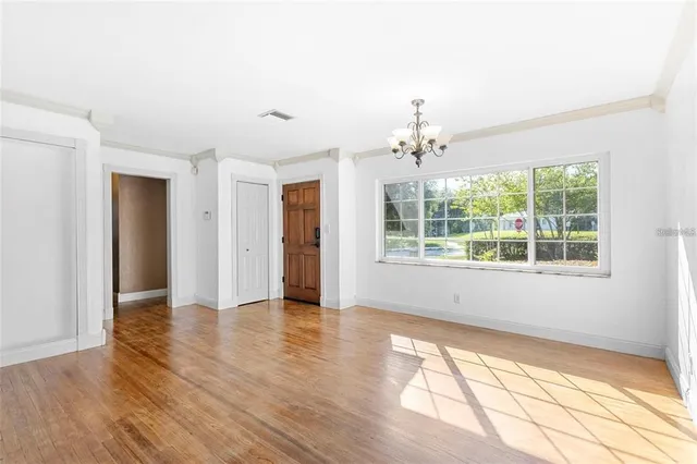 a view of an empty room with a window