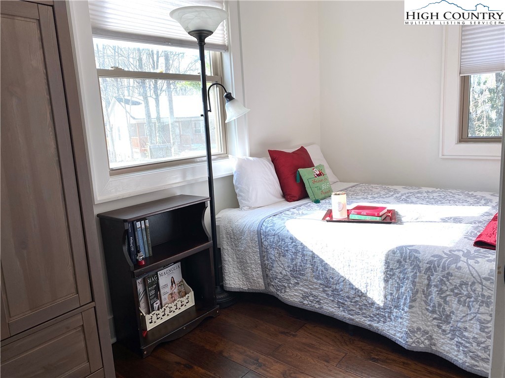 702 Pine Ridge Road Beech Mountain, NC 28604 - Photo 16 of 24 a bedroom with a bed and a window
