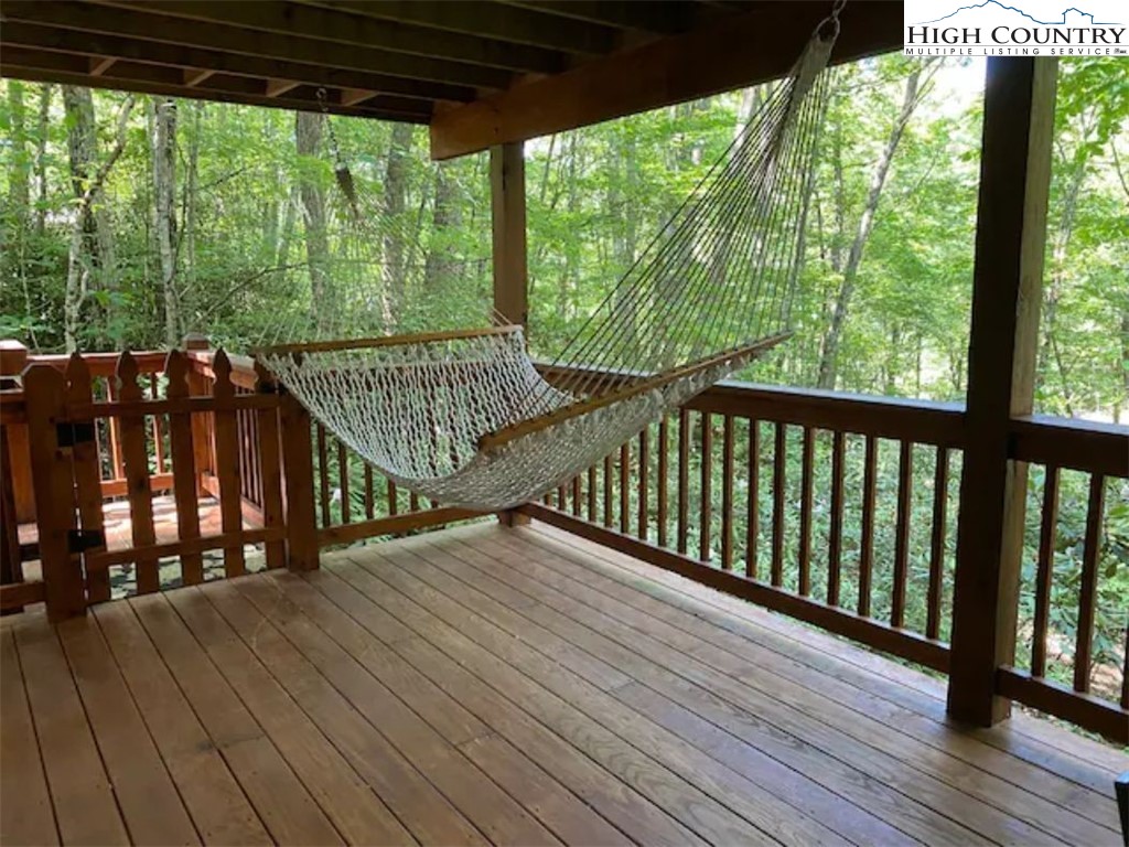 702 Pine Ridge Road Beech Mountain, NC 28604 - Photo 24 of 24 a view of a balcony with wooden floor