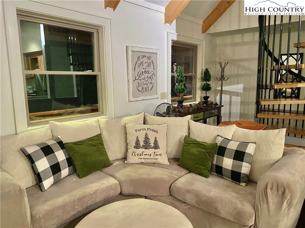 702 Pine Ridge Road Beech Mountain, NC 28604 - Photo 4 of 24 a living room with furniture and a large window