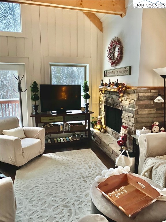 702 Pine Ridge Road Beech Mountain, NC 28604 - Photo 5 of 24 a living room with furniture and a flat screen tv