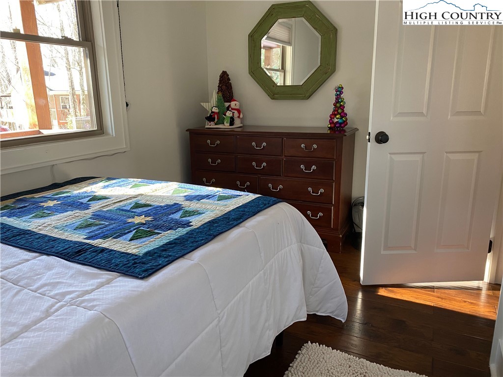 702 Pine Ridge Road Beech Mountain, NC 28604 - Photo 10 of 24 a bedroom with a bed and a dresser