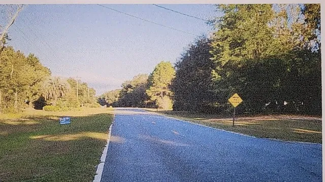 a swimming pool with an outdoor space and seating area