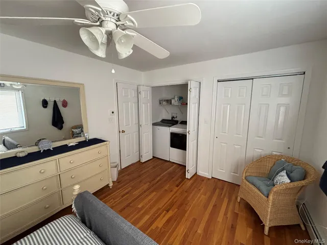 a bedroom with two beds and a chandelier