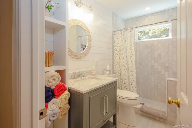 a utility room with a sink and a bed