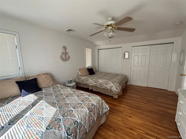 a bedroom with double bed and a window