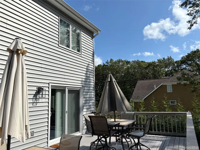 a view of a swimming pool with an outdoor space and seating area