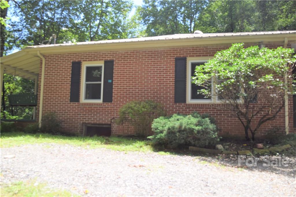 1533 Rosemount Road Sylva, NC 28779 - Photo 2 of 15 a view of a backyard with potted plants
