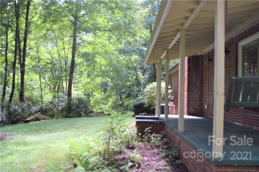 1533 Rosemount Road Sylva, NC 28779 - Photo 7 of 15 a backyard of a house with lots of green space