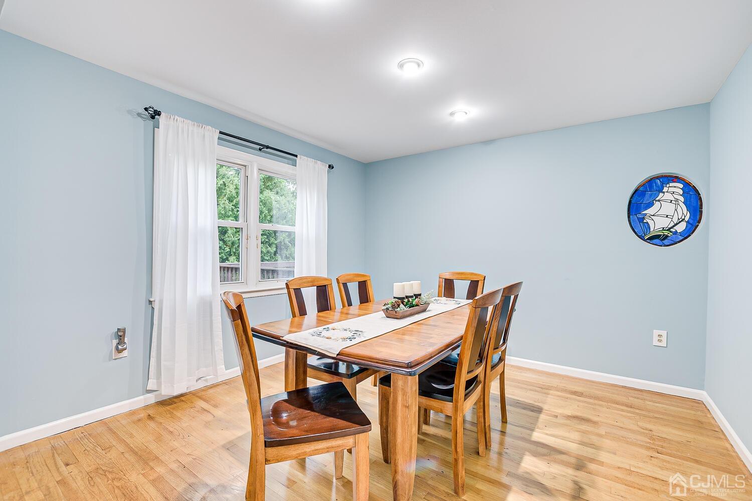 937 New Dover Road Edison, NJ 08820 - Photo 12 of 51 a view of a dining room with furniture window and outside view