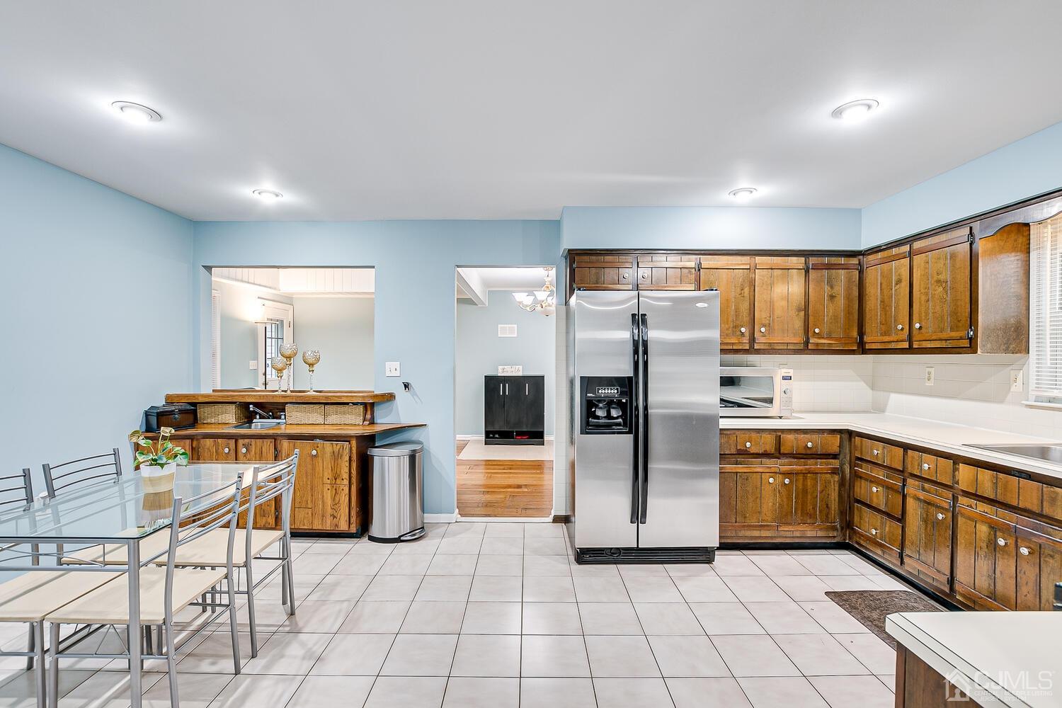 937 New Dover Road Edison, NJ 08820 - Photo 15 of 51 a kitchen with stainless steel appliances granite countertop a refrigerator and a stove top oven