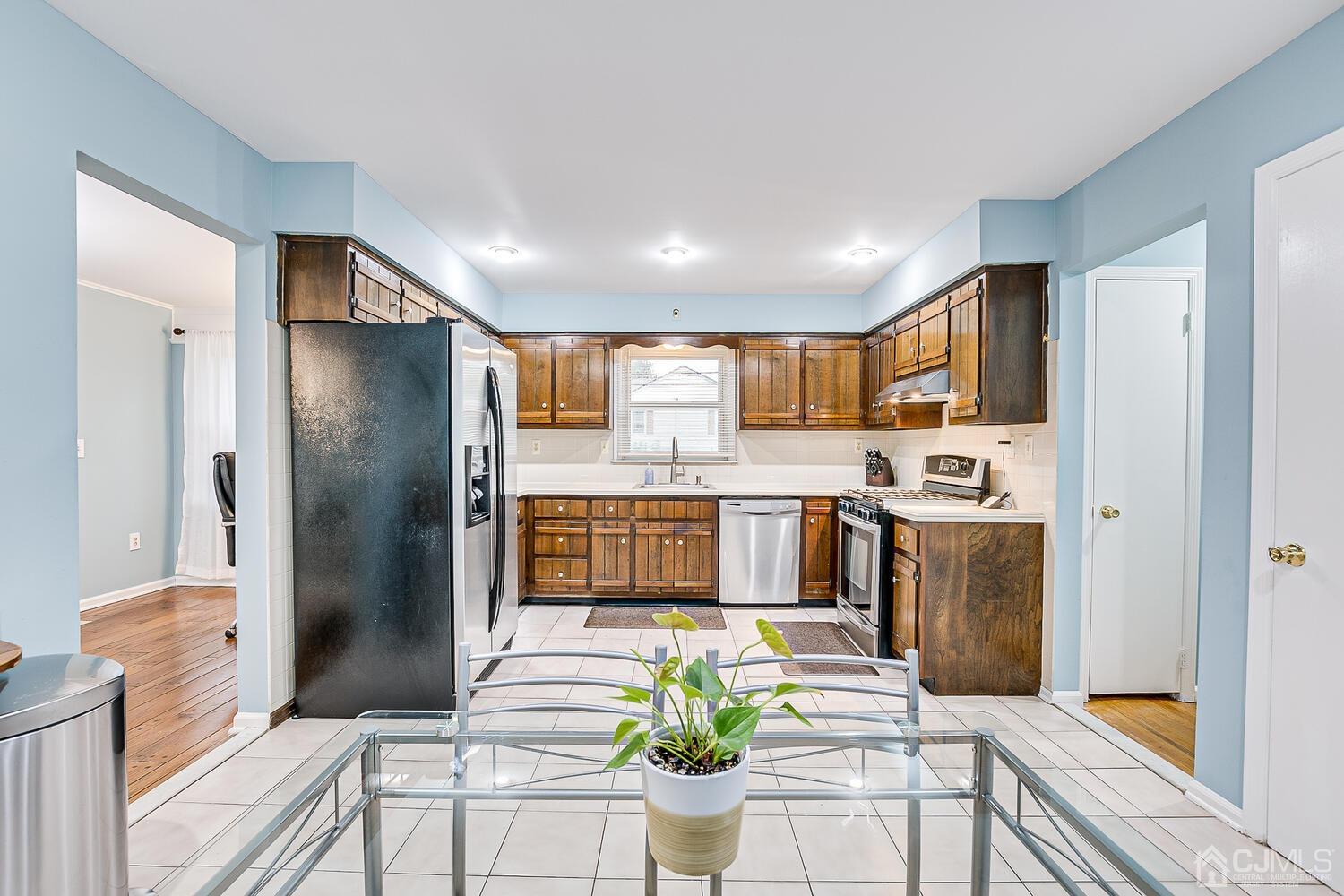 937 New Dover Road Edison, NJ 08820 - Photo 19 of 51 a kitchen with stainless steel appliances granite countertop a refrigerator and a sink