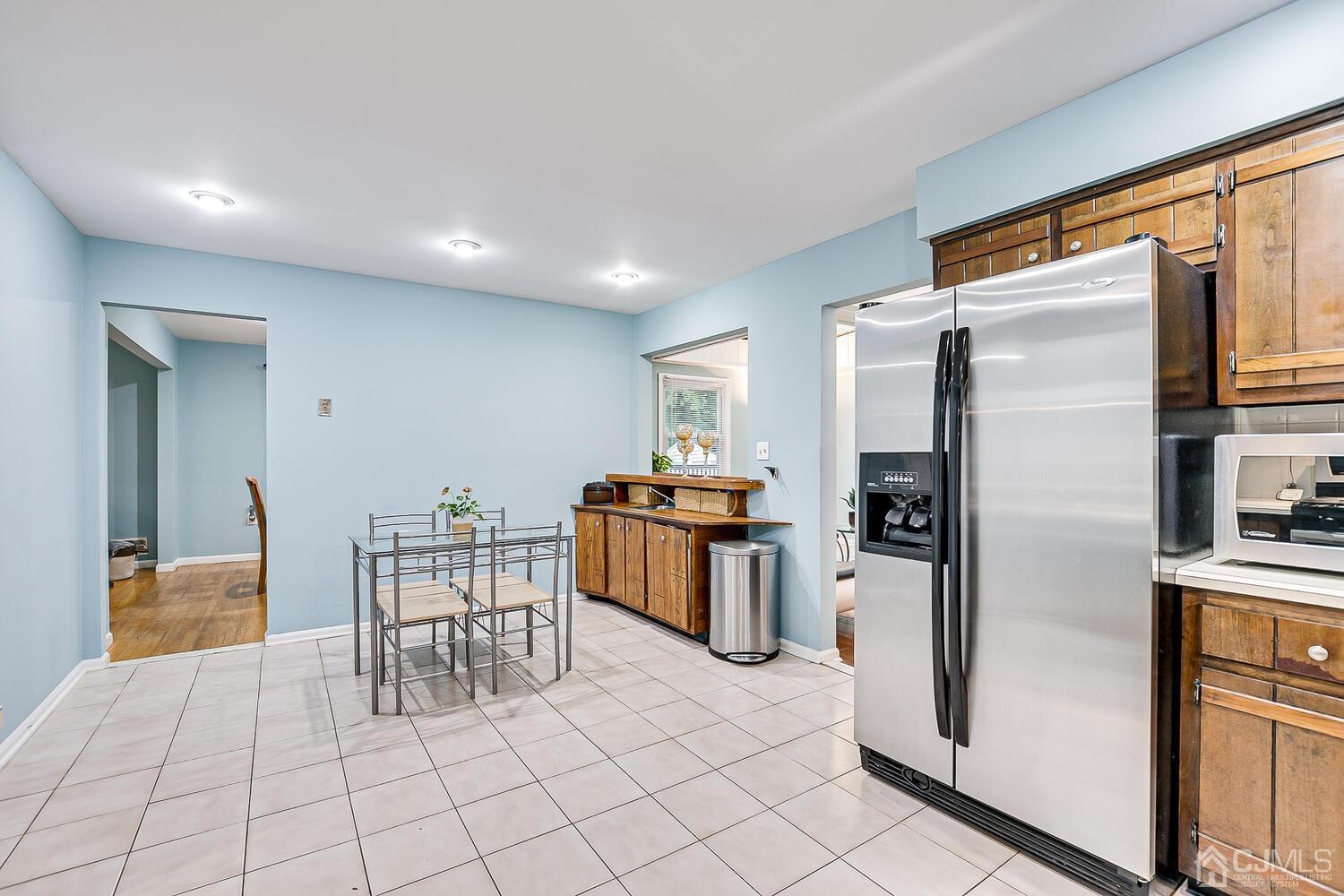 937 New Dover Road Edison, NJ 08820 - Photo 20 of 51 a kitchen with stainless steel appliances a refrigerator and a stove top oven