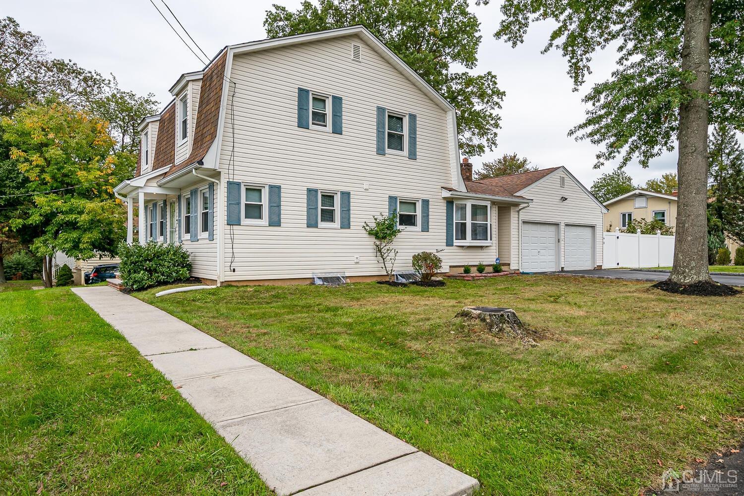 937 New Dover Road Edison, NJ 08820 - Photo 3 of 51 a front view of a house with a garden