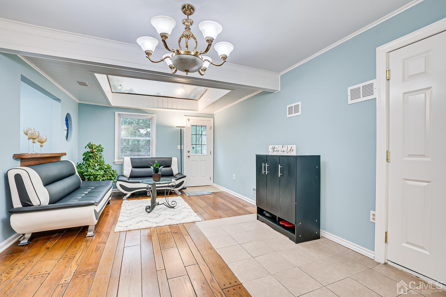 937 New Dover Road Edison, NJ 08820 - Photo 22 of 51 a living room with furniture flowerpot and a chandelier