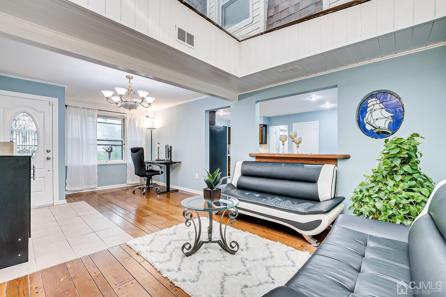 937 New Dover Road Edison, NJ 08820 - Photo 24 of 51 a living room with furniture and a table