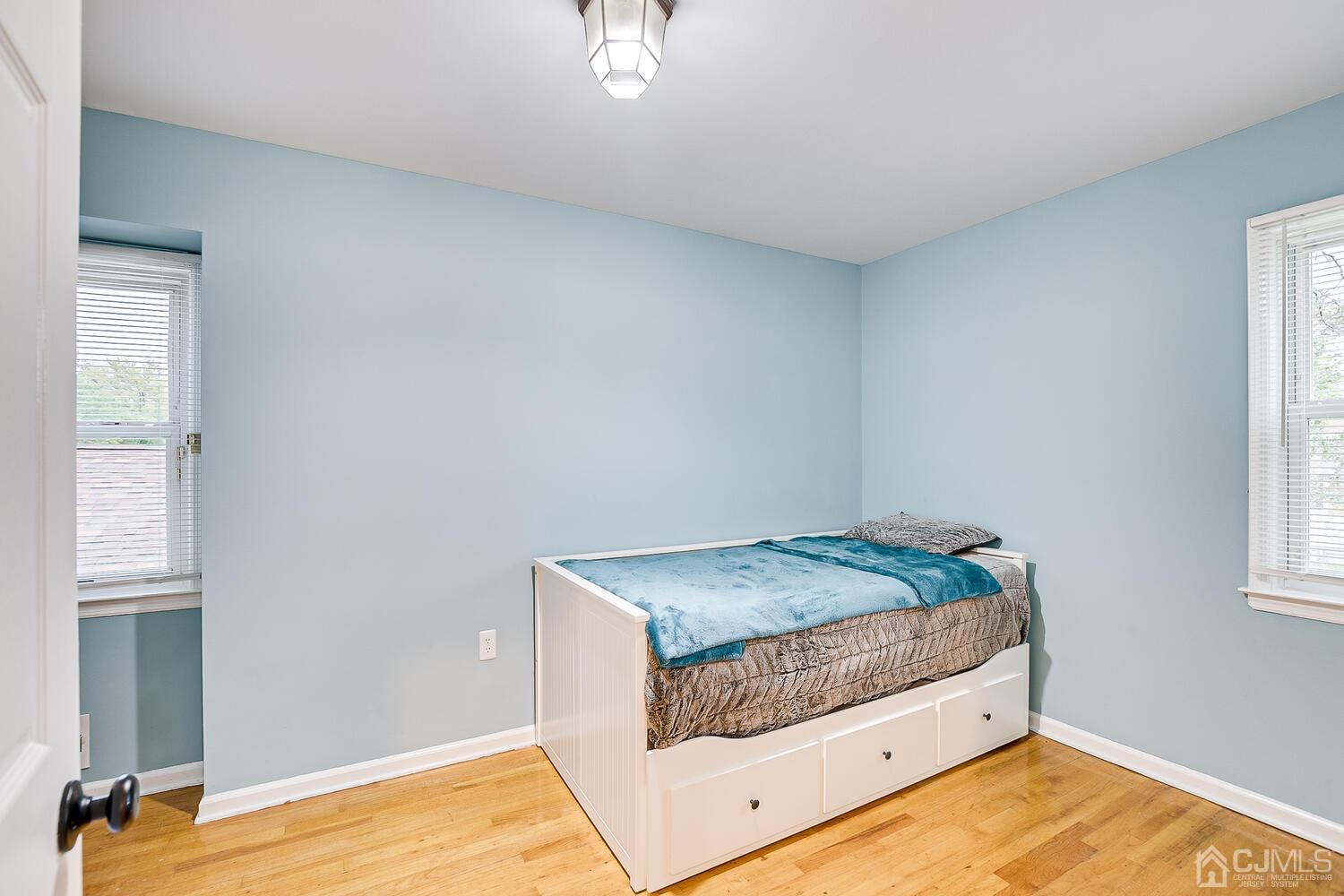 937 New Dover Road Edison, NJ 08820 - Photo 33 of 51 a bedroom with a bed and a window