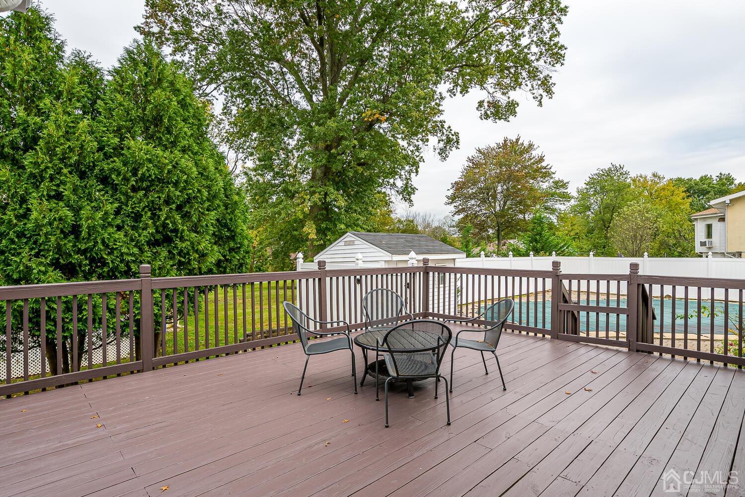 937 New Dover Road Edison, NJ 08820 - Photo 40 of 51 a view of a wooden deck with furniture