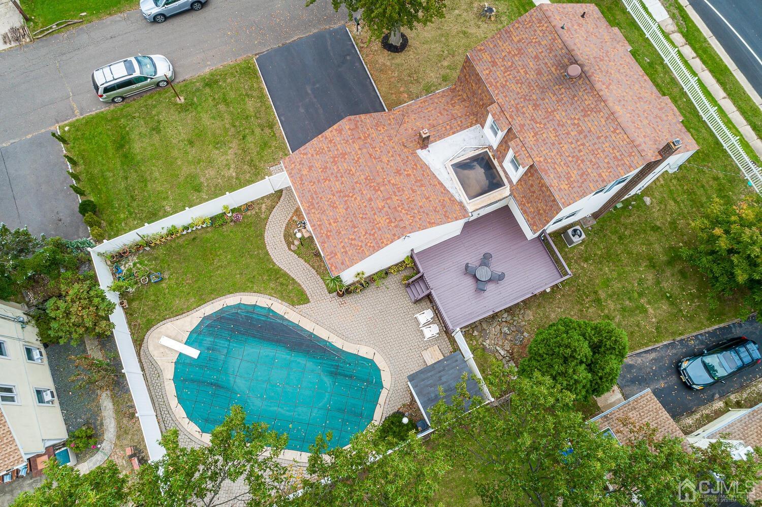 937 New Dover Road Edison, NJ 08820 - Photo 5 of 51 an aerial view of a house with a garden and trees