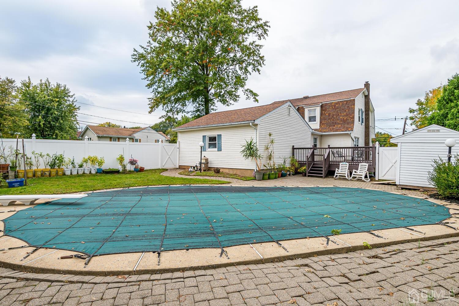 937 New Dover Road Edison, NJ 08820 - Photo 44 of 51 a view of a house with swimming pool and a yard