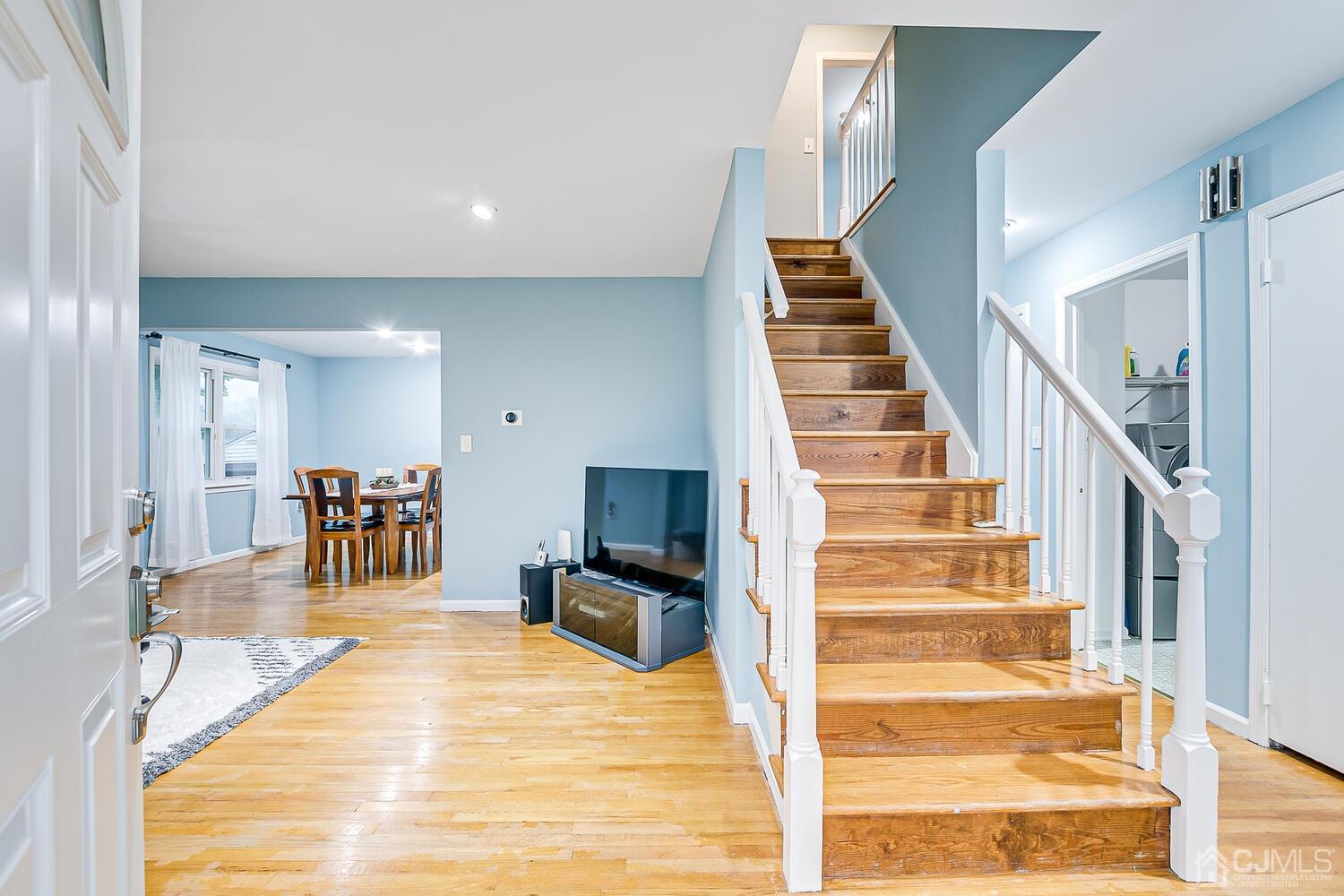 937 New Dover Road Edison, NJ 08820 - Photo 7 of 51 a view of a livingroom with furniture and stairs