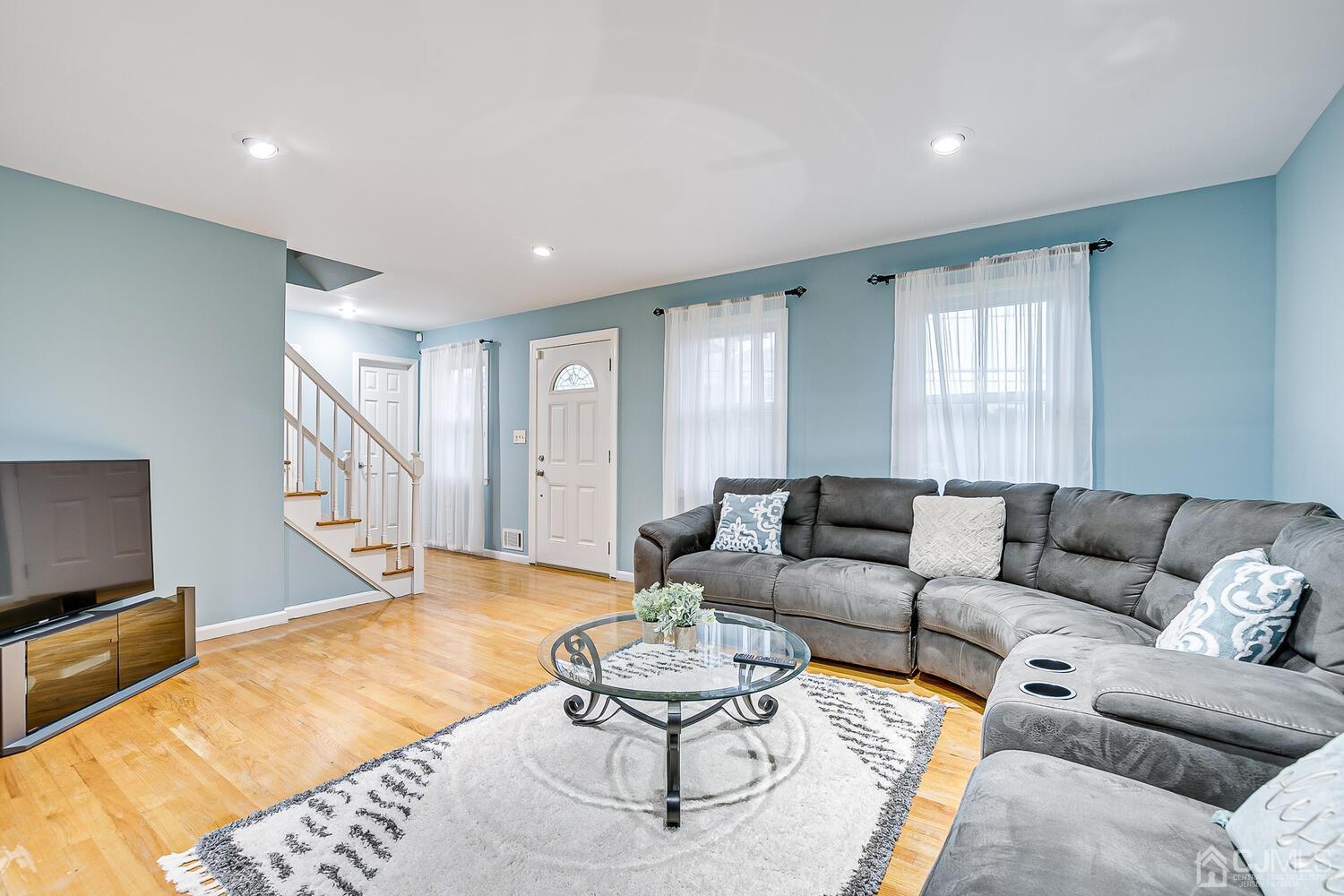 937 New Dover Road Edison, NJ 08820 - Photo 10 of 51 a living room with furniture and a flat screen tv