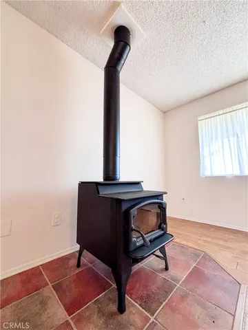 a living room with a rug and a table