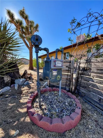 a view of a bench in the backyard