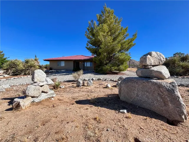 a view of swimming pool with a patio