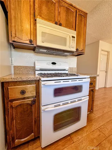 a white refrigerator freezer sitting inside of a kitchen