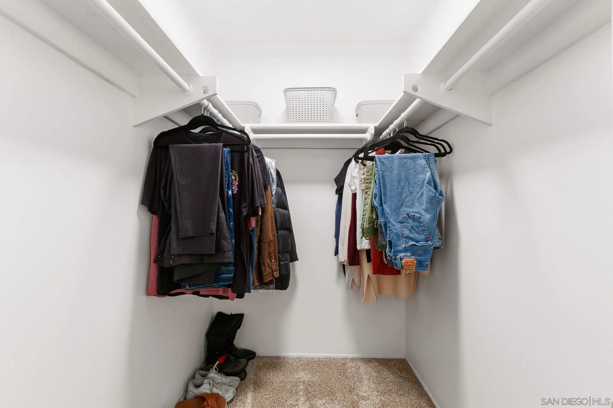 14283 Mariana Drive Poway, CA 92064 - Photo 14 of 28 a view of walk in closet with clothes and shoes