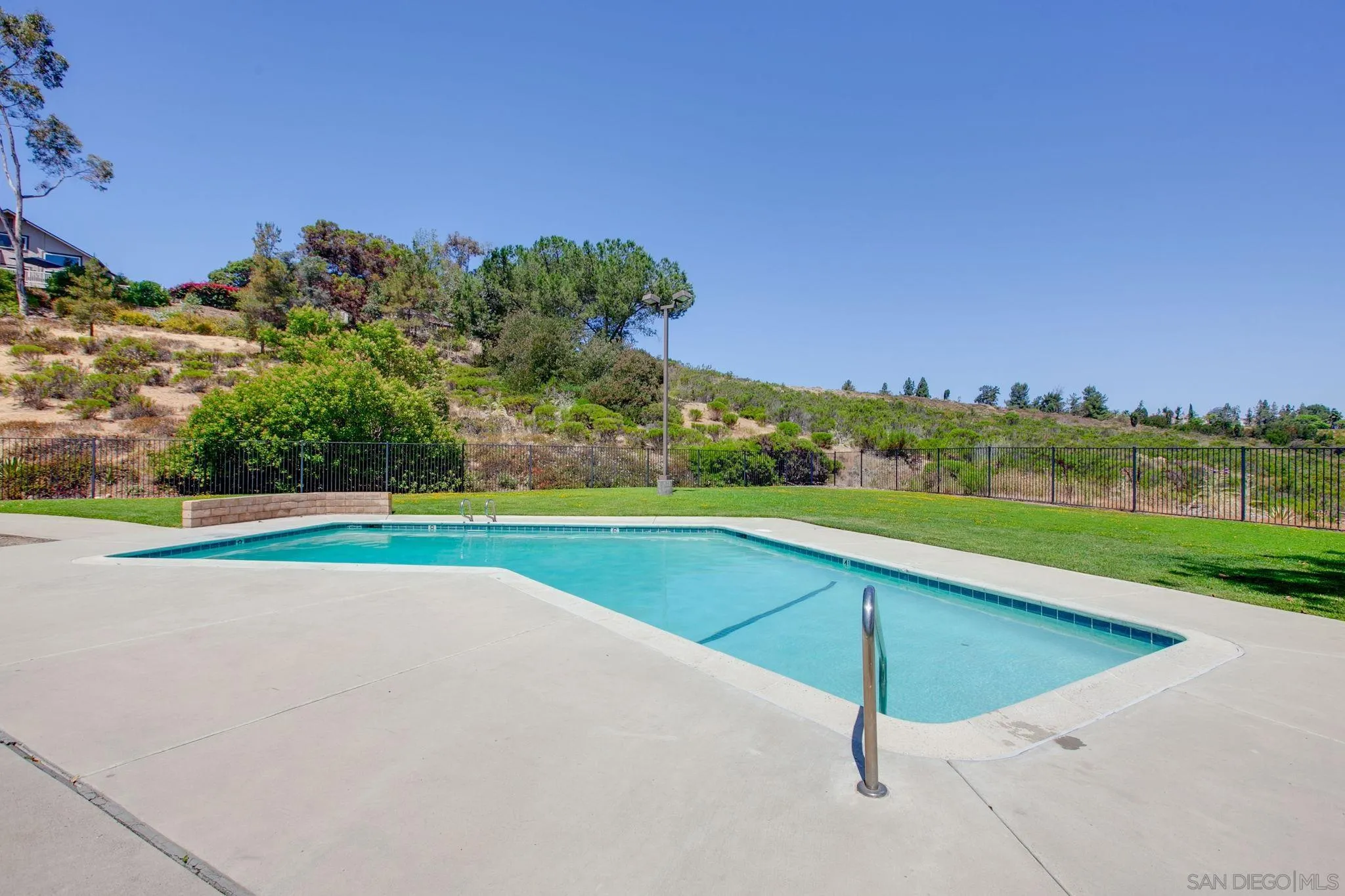 14283 Mariana Drive Poway, CA 92064 - Photo 25 of 28 a view of a swimming pool and trees in the background