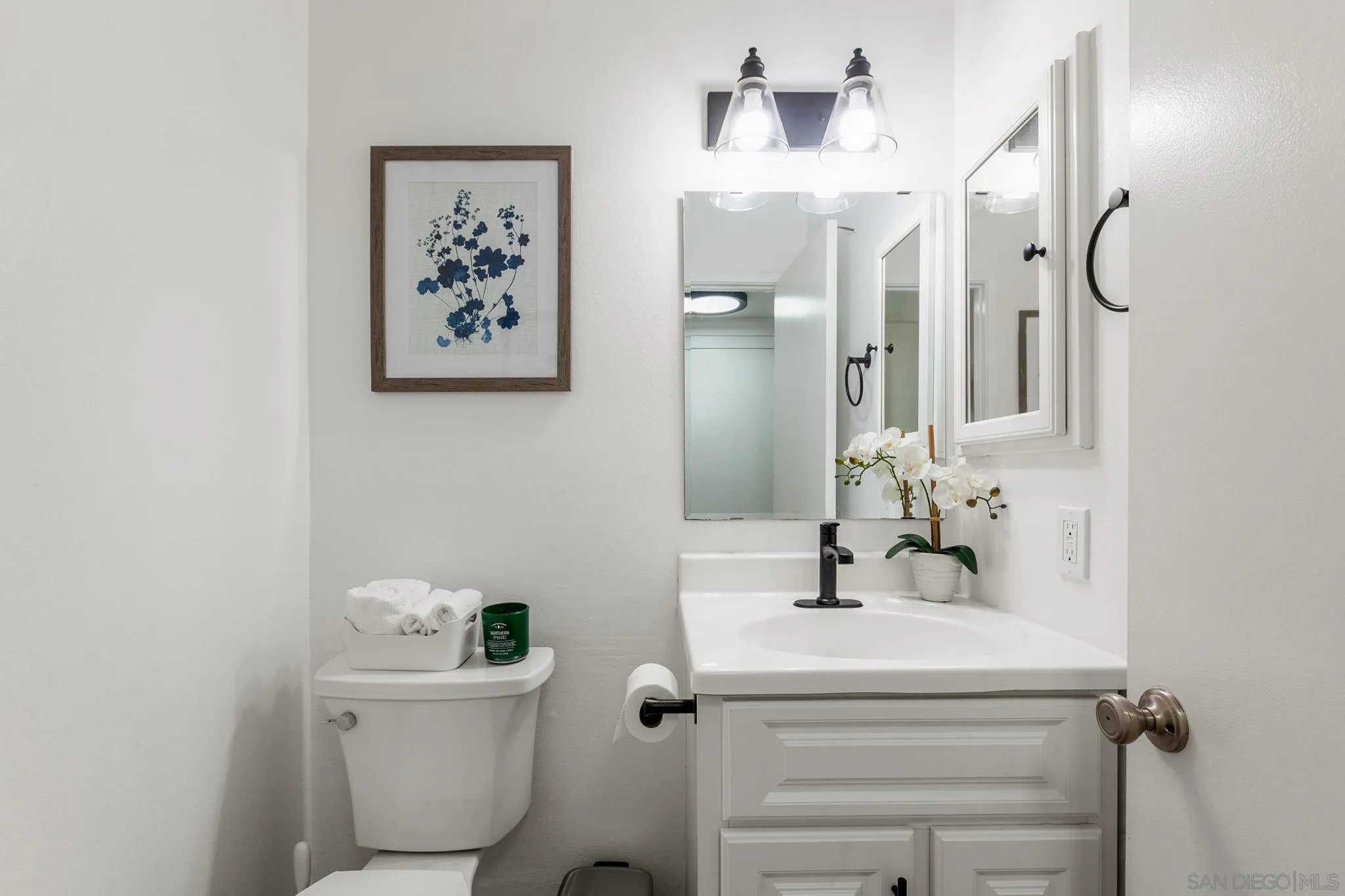 14283 Mariana Drive Poway, CA 92064 - Photo 10 of 28 a bathroom with a sink a toilet and a mirror