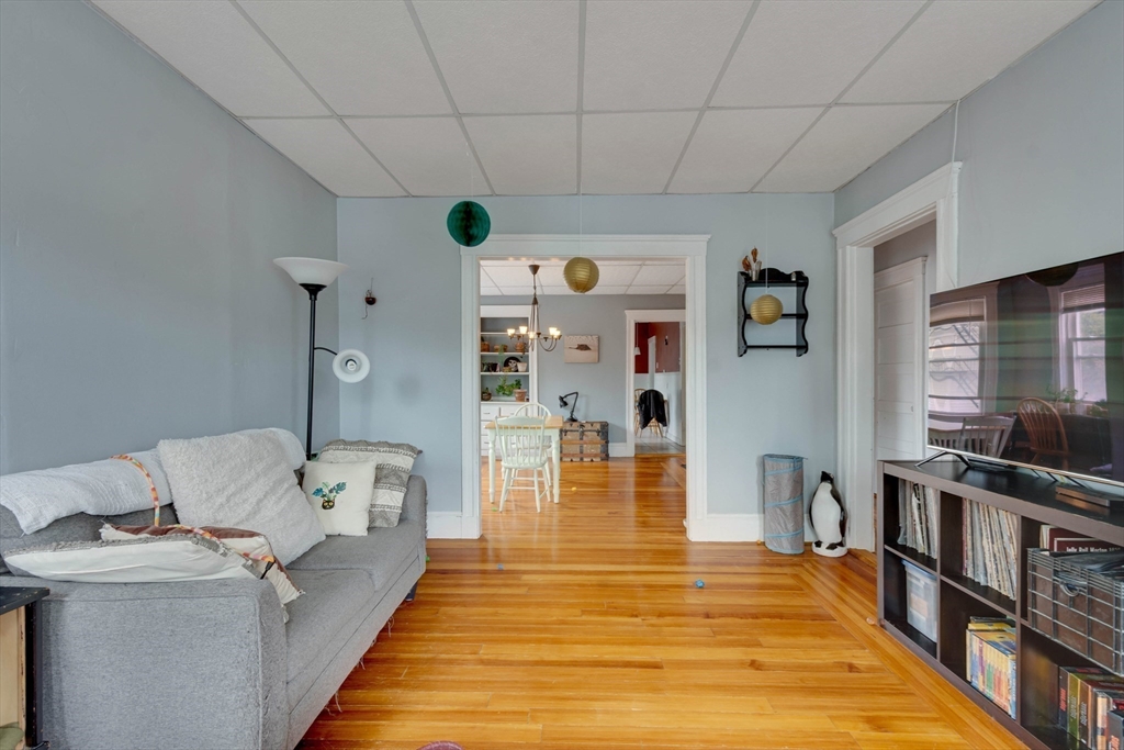 45 Jackson Road Somerville, MA 02145 - Photo 16 of 27 a living room with furniture and a table
