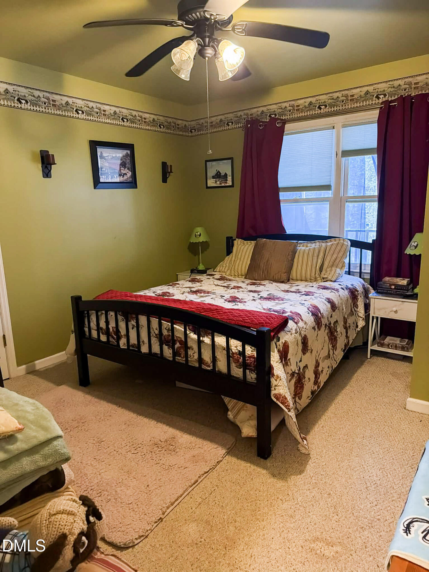 609 Shambley Road Mebane, NC 27302 - Photo 11 of 17 a bedroom with a bed and a chandelier
