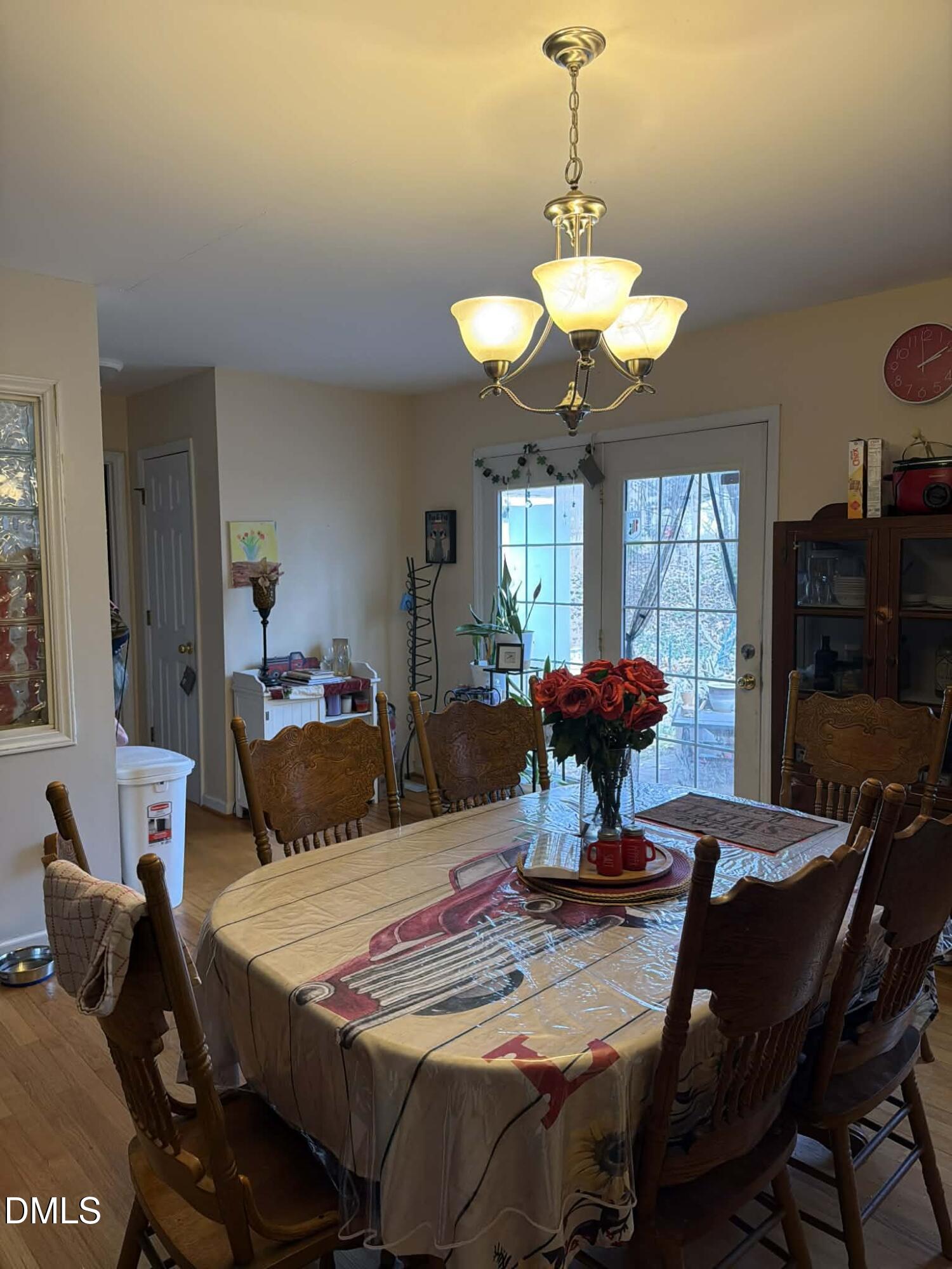 609 Shambley Road Mebane, NC 27302 - Photo 14 of 17 a view of a dining room with furniture and a chandelier